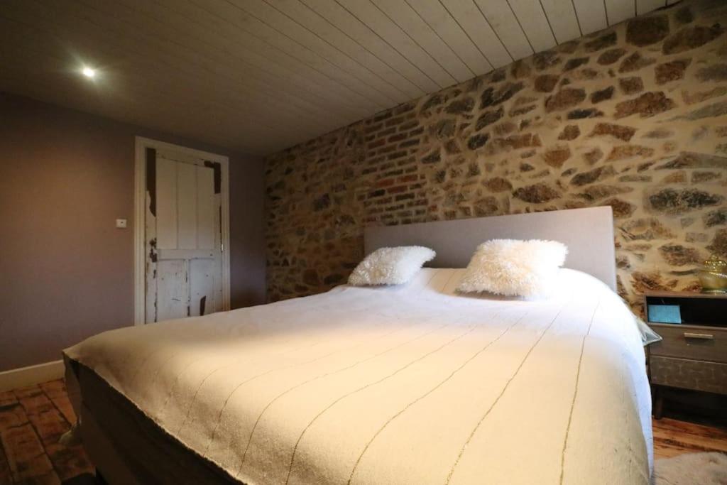 Postel nebo postele na pokoji v ubytování Clos des Rogations