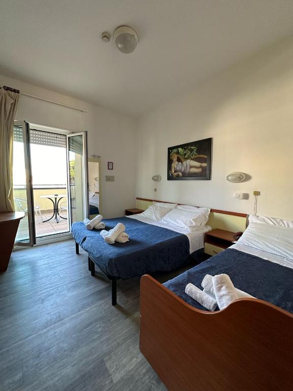 Postel nebo postele na pokoji v ubytování Nuovo hotel ANTHISA