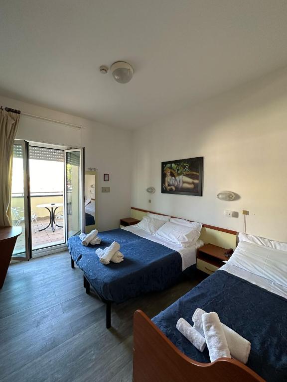 Postel nebo postele na pokoji v ubytování Nuovo hotel ANTHISA