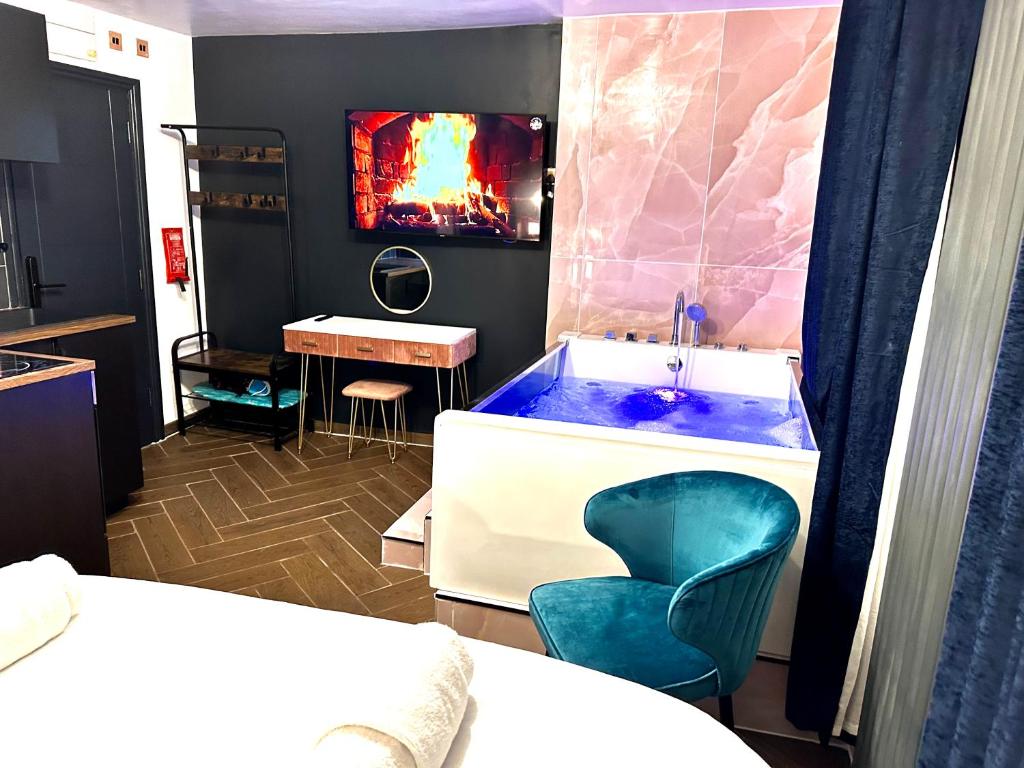 a bathroom with a tub with a sink and a chair at G Eighty Four in London