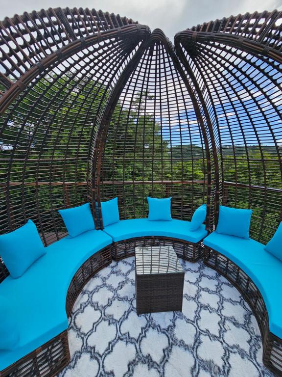 a batting cage at a resort with blue pillows at Golden Pear Villa-CR in Confer