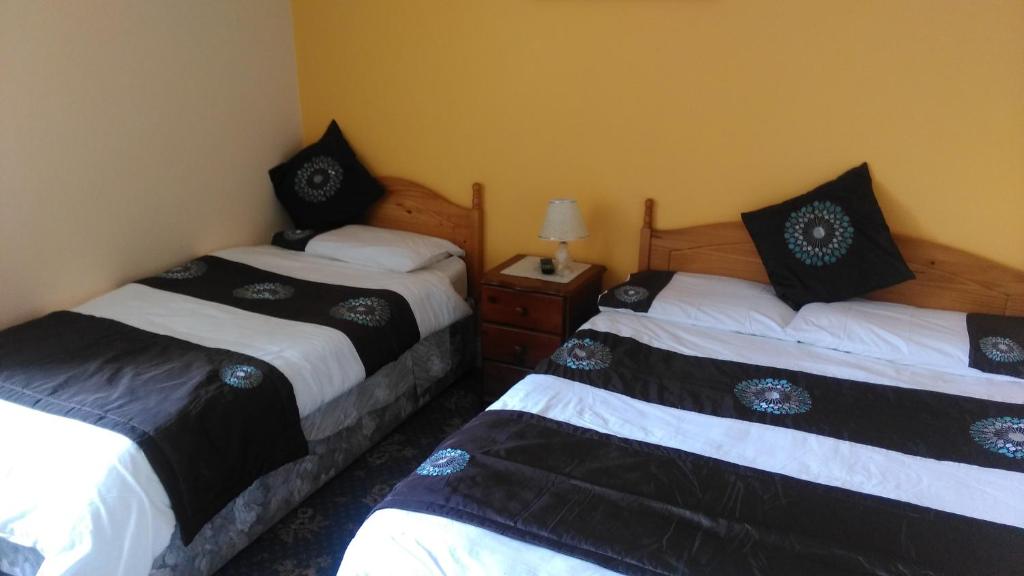 Postel nebo postele na pokoji v ubytování Achill Isle House