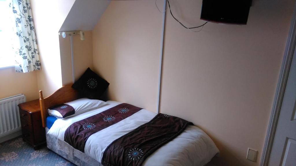 Postel nebo postele na pokoji v ubytování Achill Isle House
