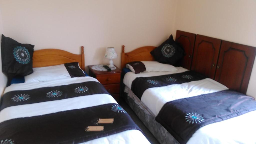 Postel nebo postele na pokoji v ubytování Achill Isle House