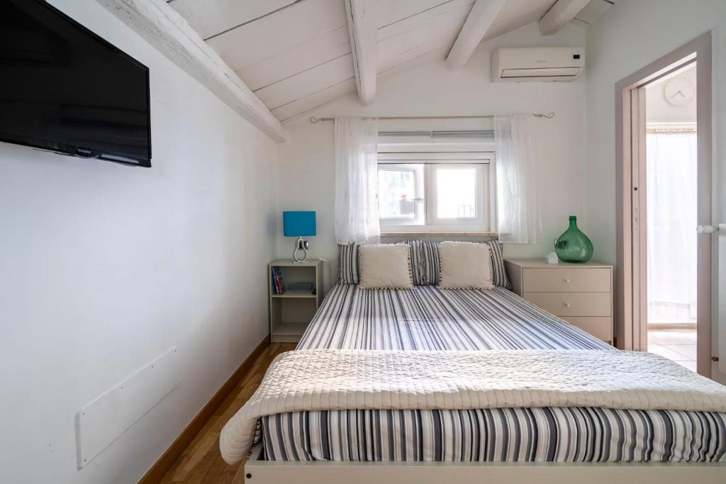 Postel nebo postele na pokoji v ubytování Cesarotti B&B