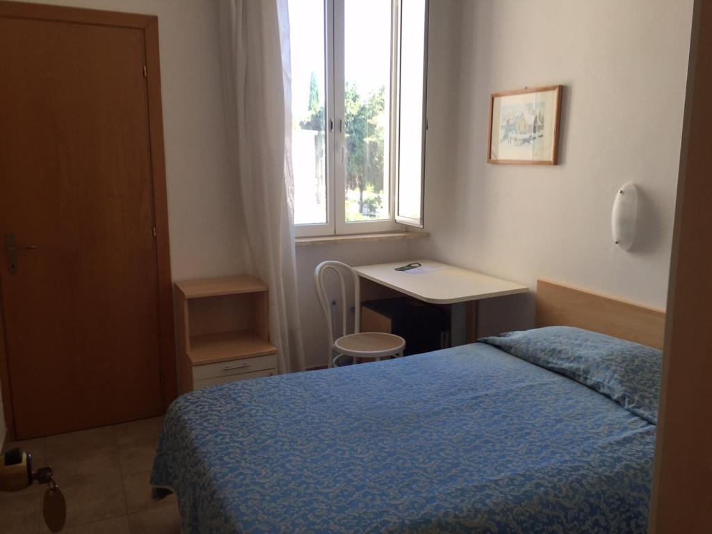 Postel nebo postele na pokoji v ubytování Hotel Lido
