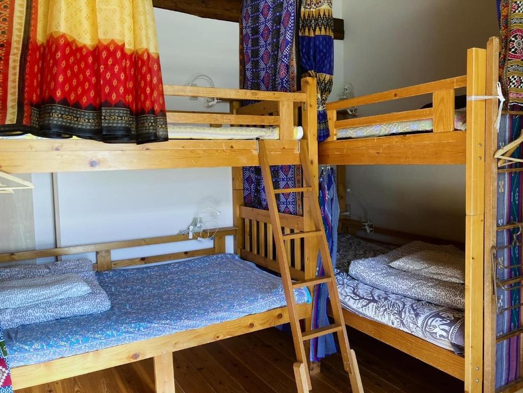 Postel nebo postele na pokoji v ubytování Santana Guest House Kyoto