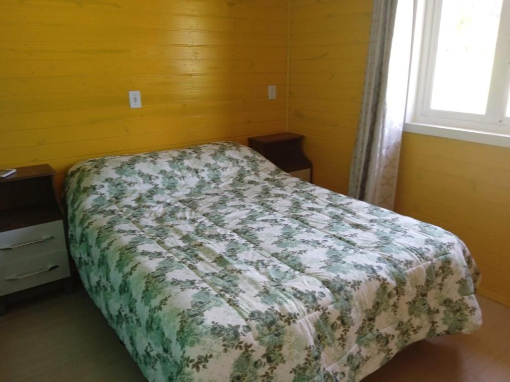 Giường trong phòng chung tại Casa das Palmeiras