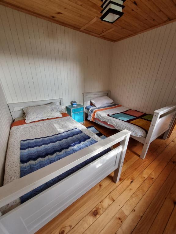 Postel nebo postele na pokoji v ubytování Cabaña en Contulmo