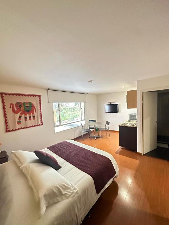 Postel nebo postele na pokoji v ubytování Hotel Juliette Bogota