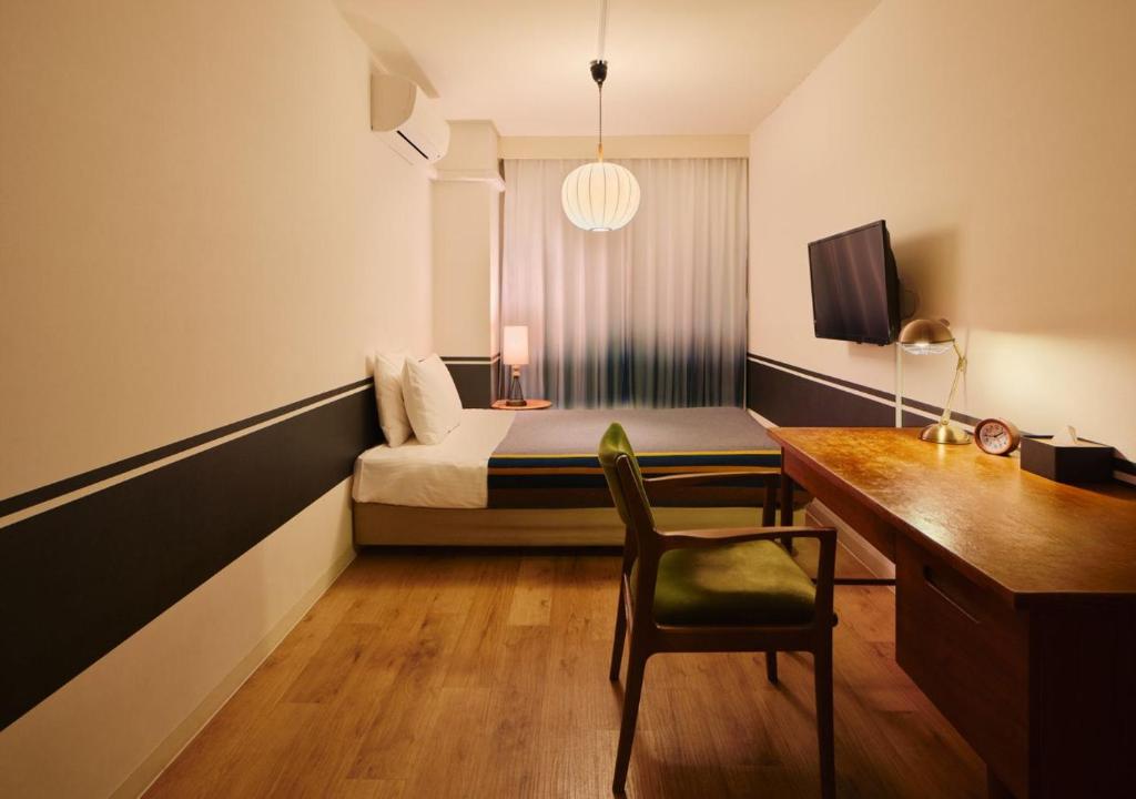 TV a/nebo společenská místnost v ubytování Hotel Graphy Nezu
