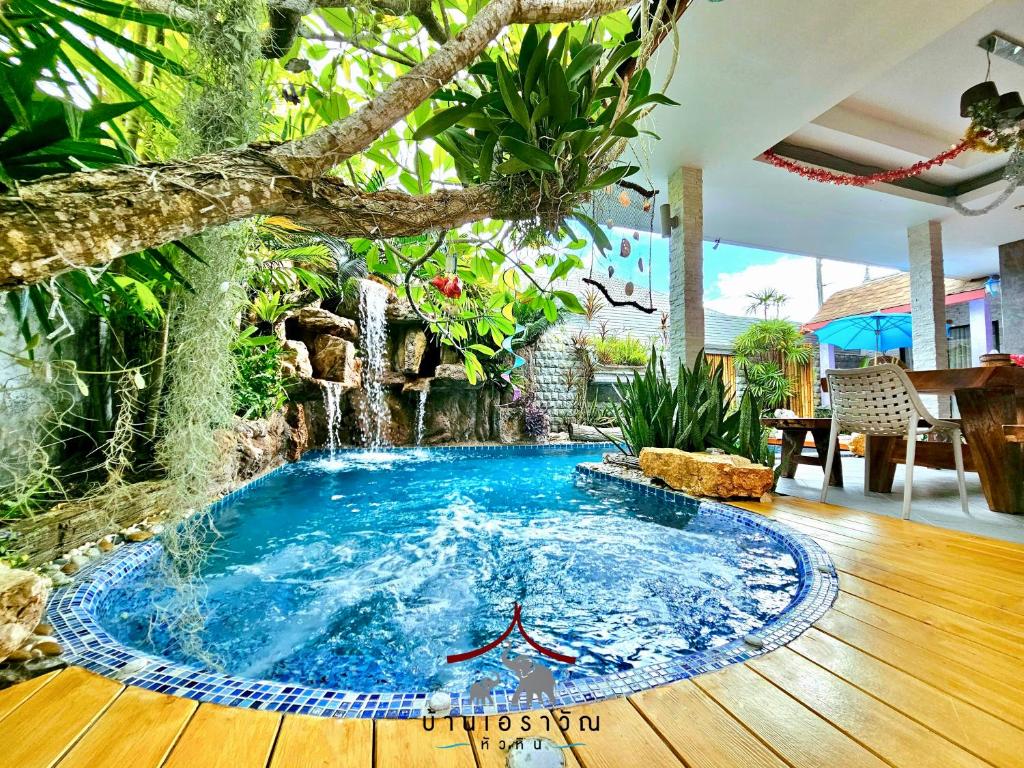 a pool in the middle of a room with a tree at Arawan Pool Villa Hua Hin in Hua Hin