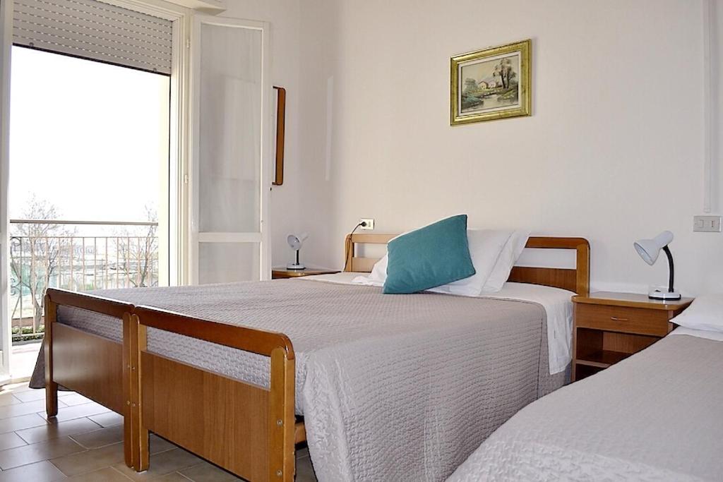 Posteľ alebo postele v izbe v ubytovaní Sportur Club Hotel