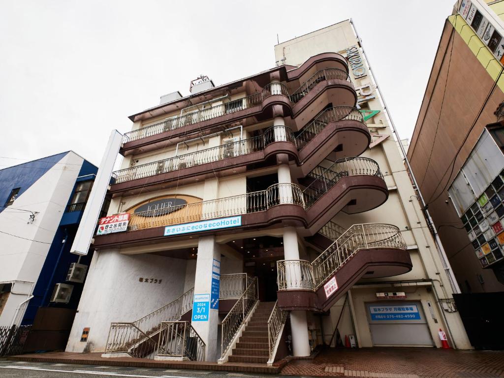 a building with stairs on the side of it at ecoHotel in Toyama