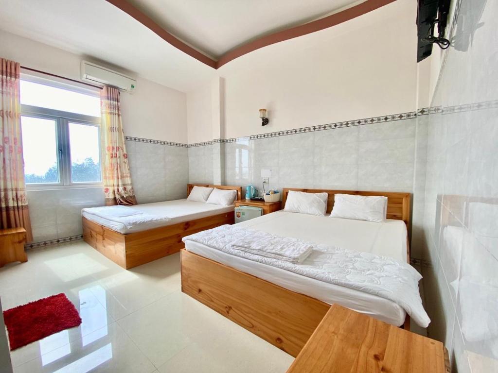 Ένα ή περισσότερα κρεβάτια σε δωμάτιο στο Sao Biển Hotel - Đảo Phú Quý