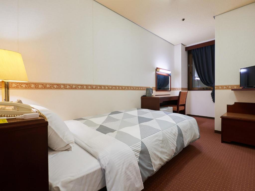 Postel nebo postele na pokoji v ubytování ecoHotel
