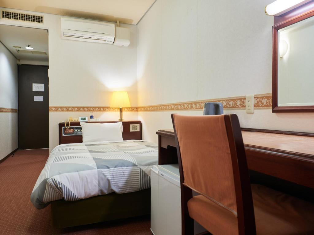 Postel nebo postele na pokoji v ubytování ecoHotel