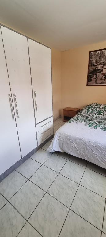 Postel nebo postele na pokoji v ubytování CHEZ LILIANE