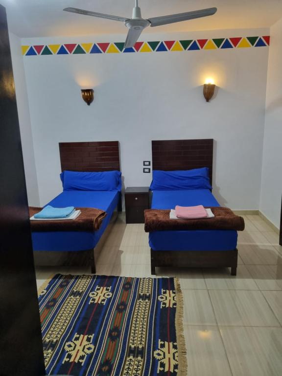 Postel nebo postele na pokoji v ubytování ABAZIDO Nubian Guest House