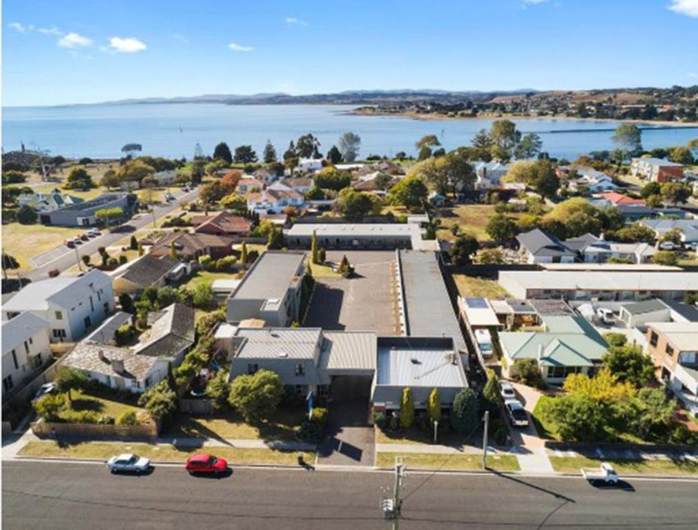 an aerial view of a small town with a body of water at Sunrise Devonport in Devonport