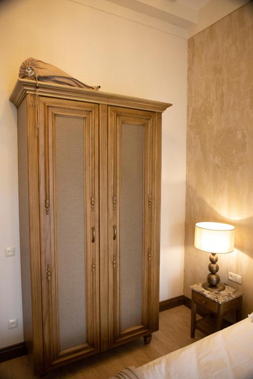 Postel nebo postele na pokoji v ubytování Boutique ETHNO HOTEL
