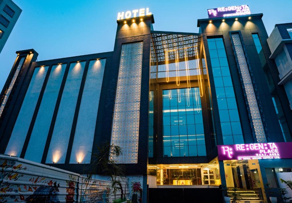 a hotel in the city at night at Regenta Place Raaj Agra in Agra