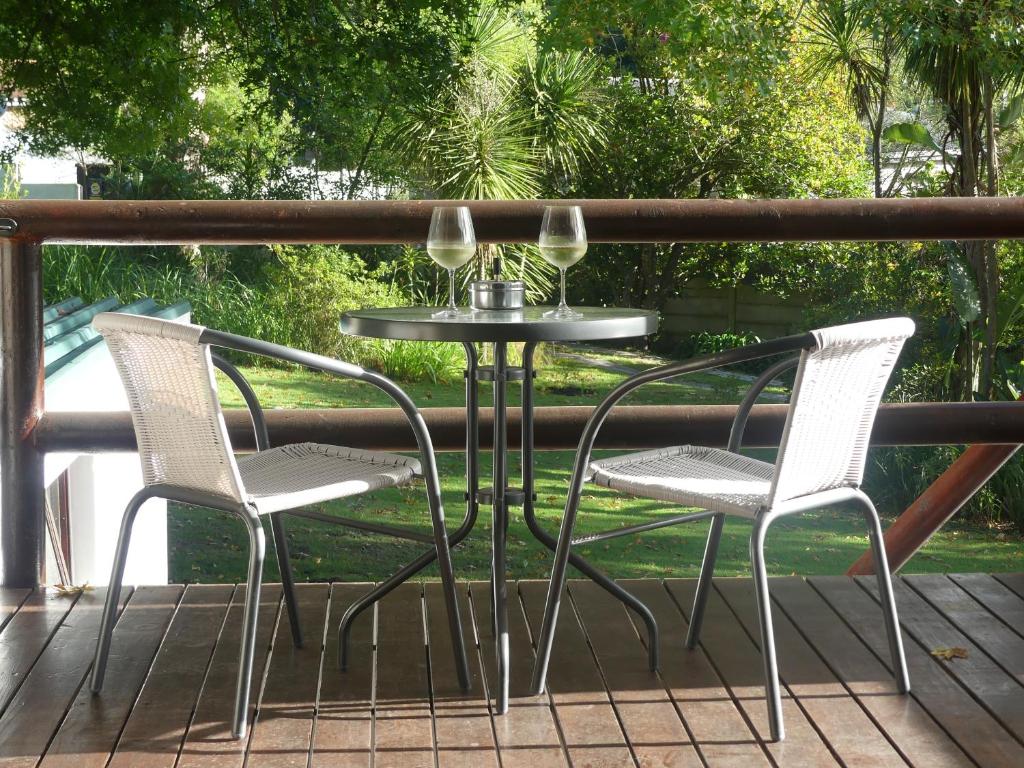 two chairs and a table on a deck at 62 on Adderley in George