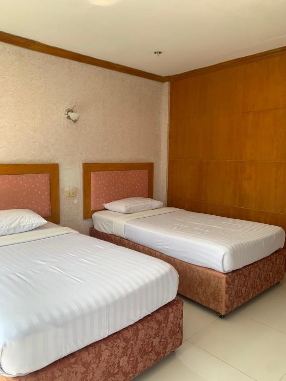 Postel nebo postele na pokoji v ubytování N.P.Place Resort&Hotel