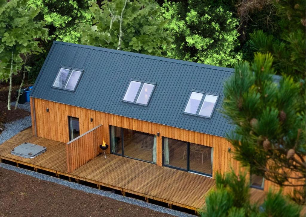 an overhead view of a house with a deck at Forest Corner Luxury Home with Hot Tub in North Ballachulish