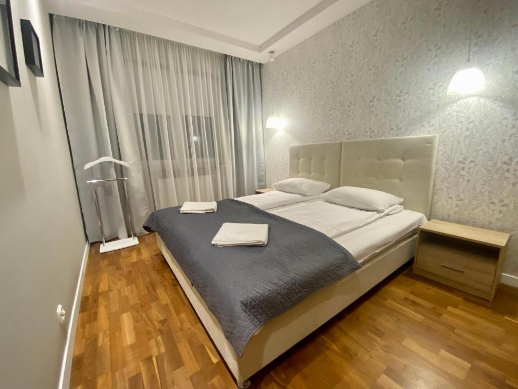 Posteľ alebo postele v izbe v ubytovaní Apartament Toruń