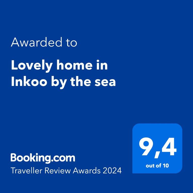 a blue sign with the text awarded to lovely home in inco by the sea at Lovely home in Inkoo by the sea in Inkoo