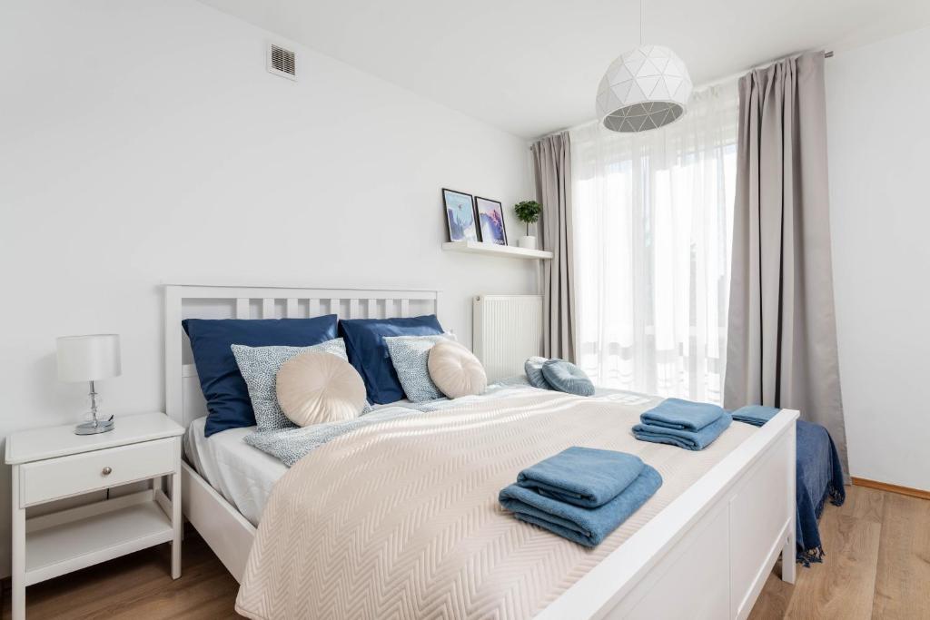 Posteľ alebo postele v izbe v ubytovaní Jonagold Apartment Metro Raclawicka