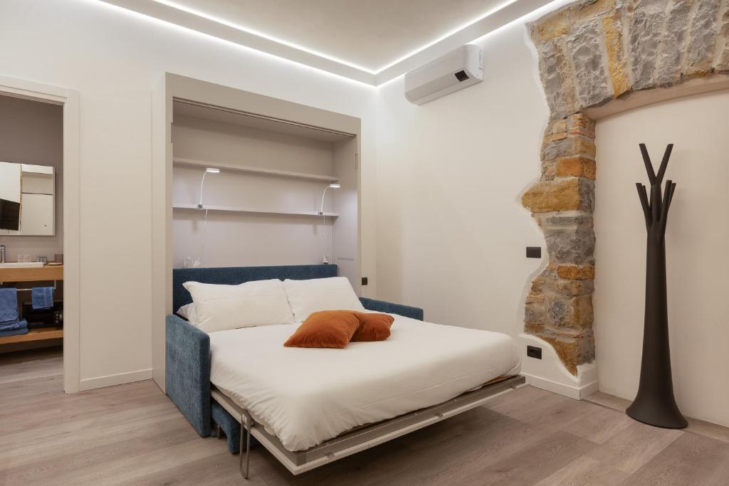 Postel nebo postele na pokoji v ubytování San Nicolò Suites