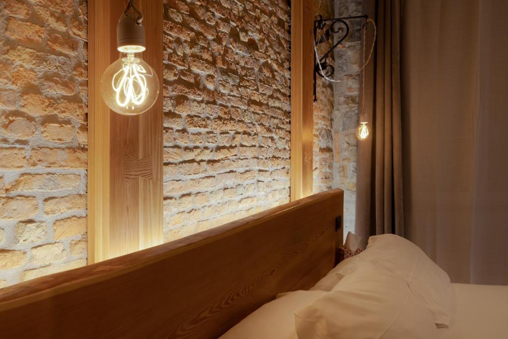 Postel nebo postele na pokoji v ubytování San Nicolò Suites