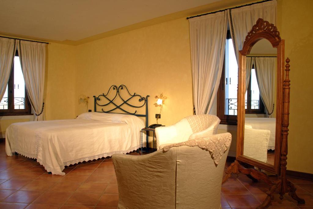 Postel nebo postele na pokoji v ubytování Agriturismo Macesina