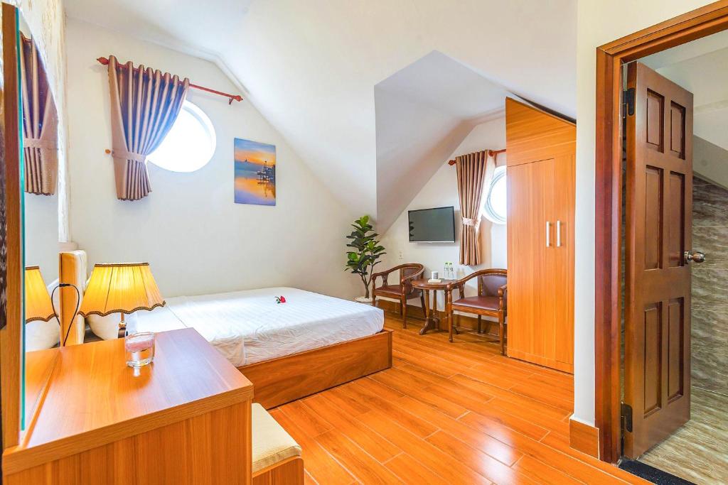 Giường trong phòng chung tại Villa Hoa Ly Đà Lạt