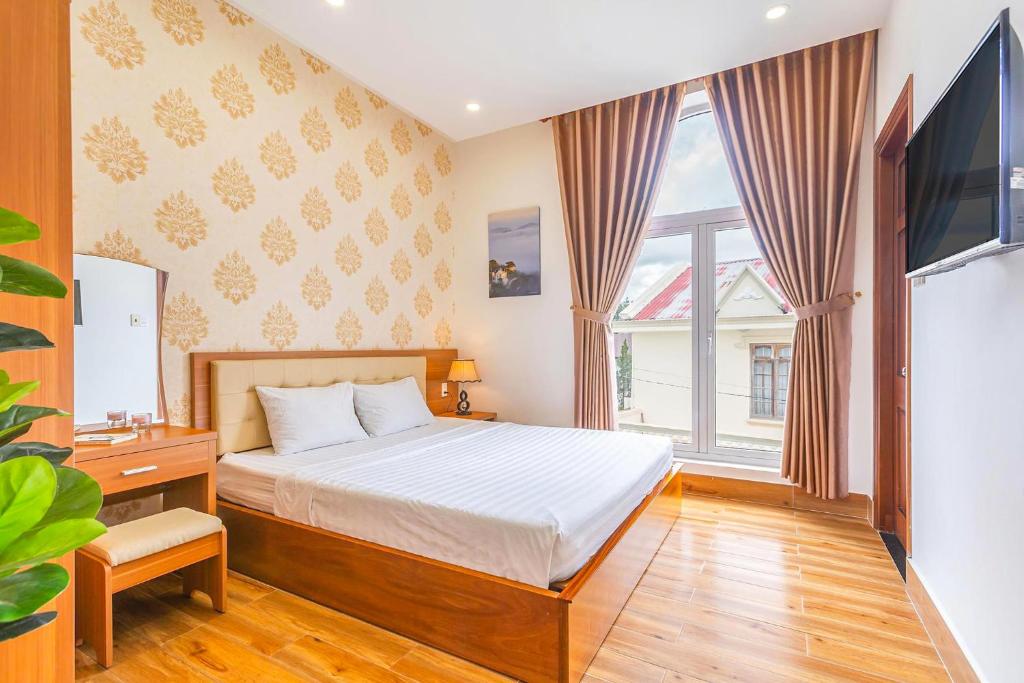 Giường trong phòng chung tại Villa Hoa Ly Đà Lạt