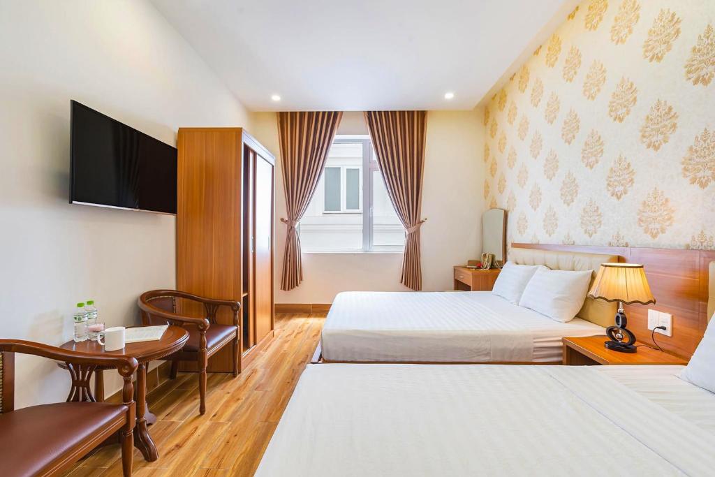 Giường trong phòng chung tại Villa Hoa Ly Đà Lạt