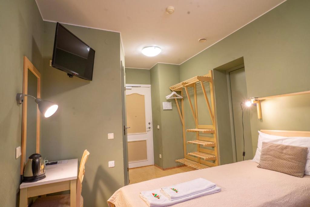 Postel nebo postele na pokoji v ubytování Kongo Hotel