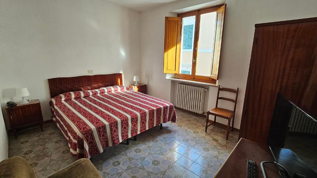 Postel nebo postele na pokoji v ubytování Verena Dependance Savoia & Campana