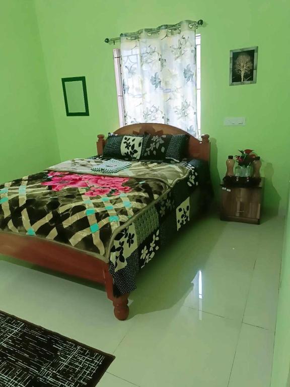a bedroom with a bed and a window at Michelle Residency in Rourkela