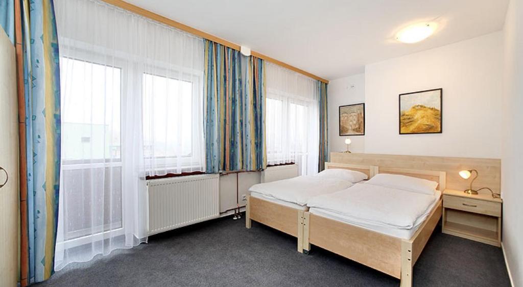 Postel nebo postele na pokoji v ubytování HOTEL RAJSKY