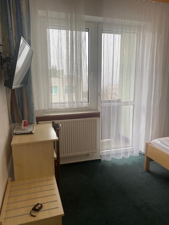Postel nebo postele na pokoji v ubytování HOTEL RAJSKY