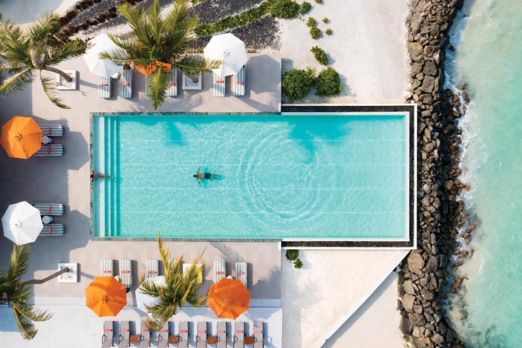 an overhead view of a swimming pool on the beach at OBLU SELECT Lobigili - Premium All-Inclusive with Free Transfers in Male City