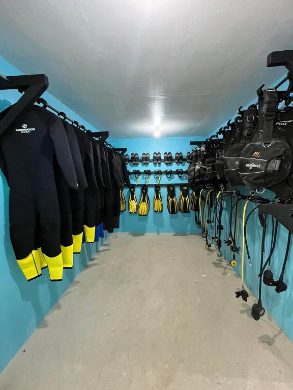 a dressing room filled with lots of cycling equipment at Seaside Hostel Malapascua in Malapascua Island