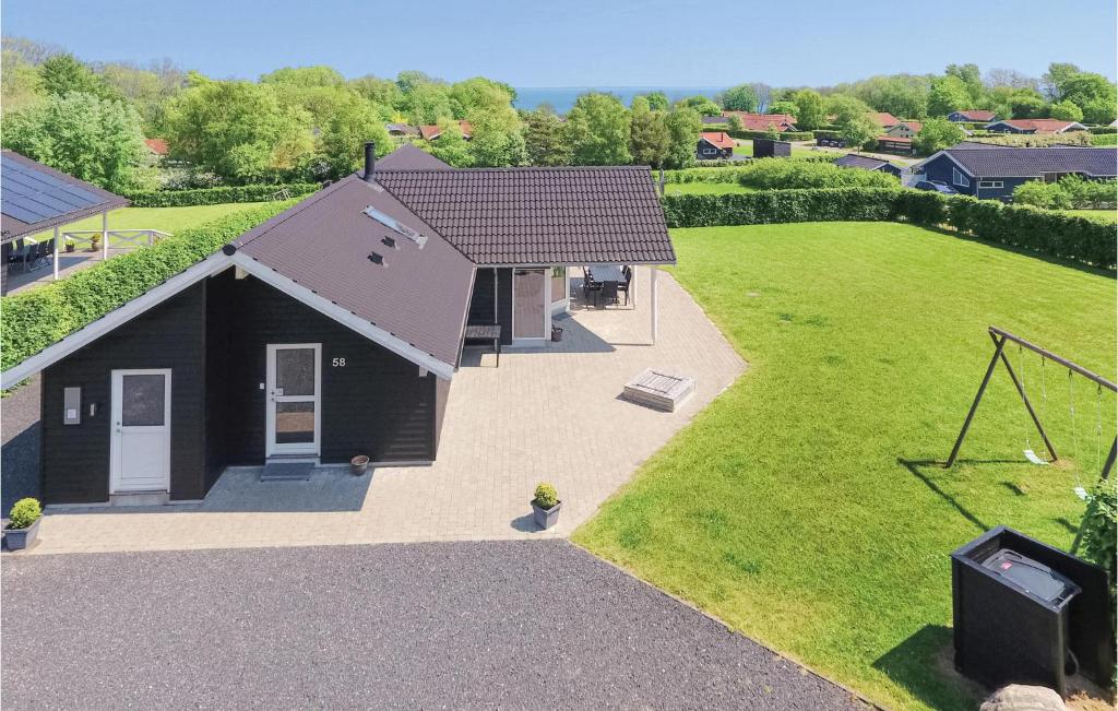 an overhead view of a small house with a yard at Holiday Home Fiskervej Sydals I in Skovby