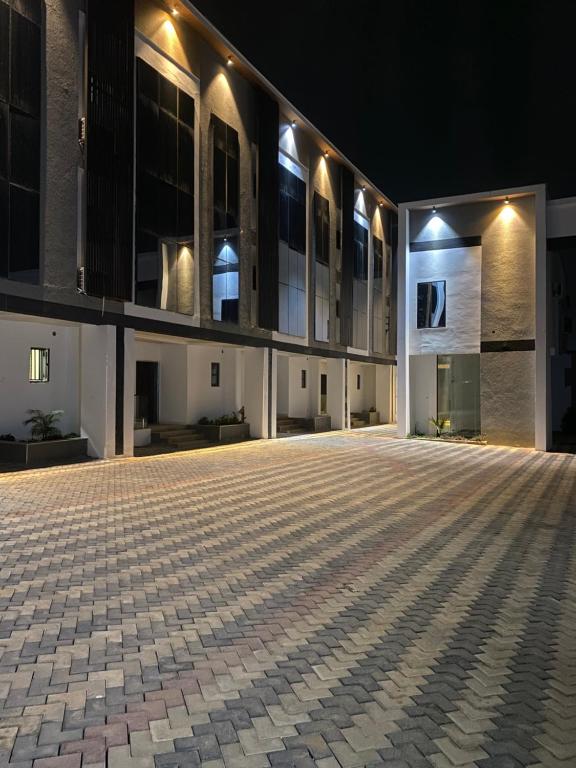 an empty courtyard of a building at night at MAJESTIC VILLA RESIDENCE in Ankuru