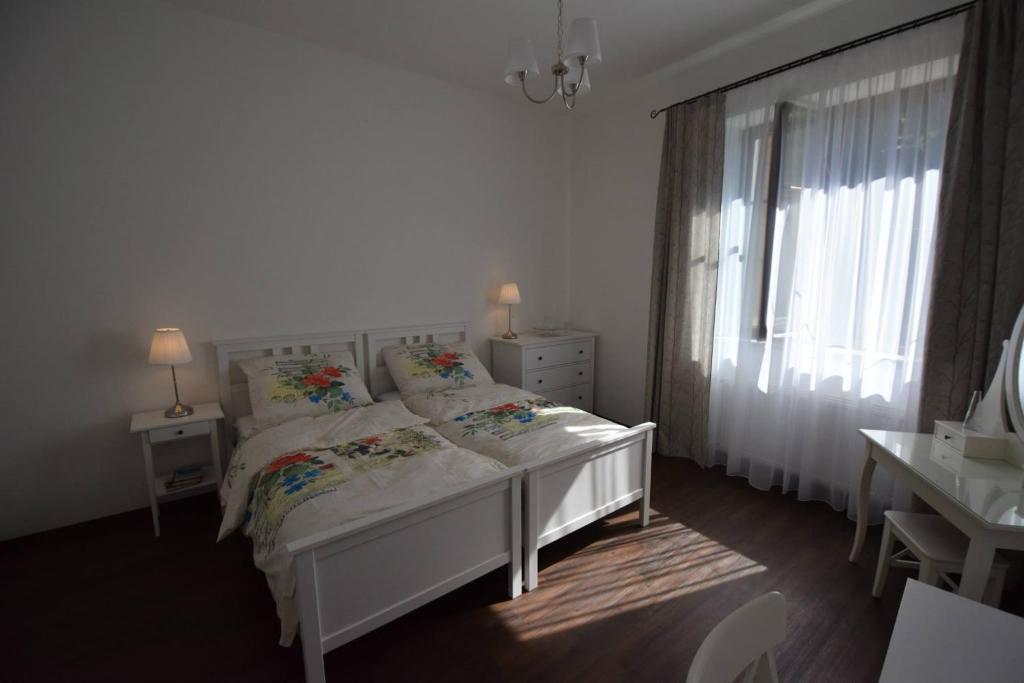 Postel nebo postele na pokoji v ubytování Hnízdo Snů