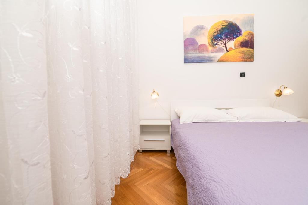Postel nebo postele na pokoji v ubytování Aparment Kod Kule