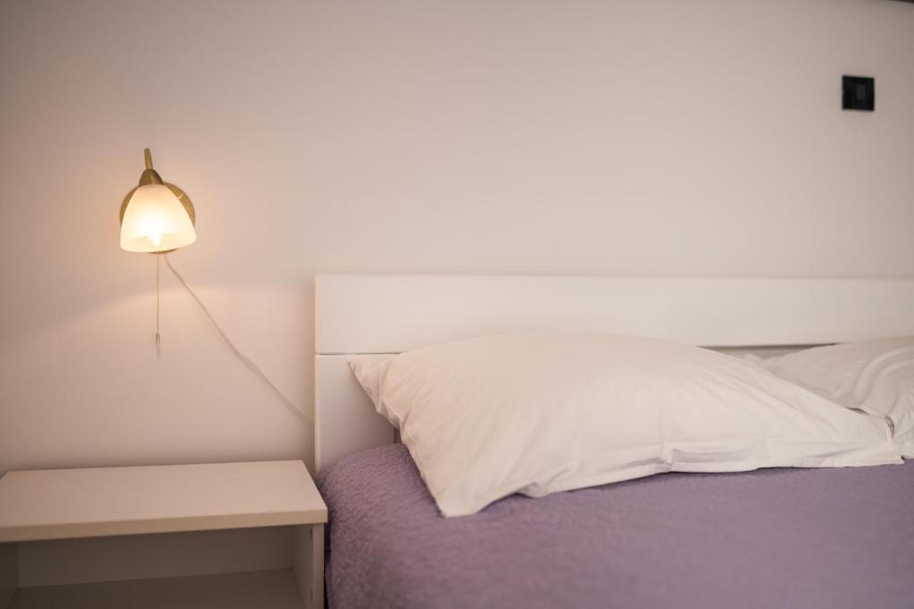 Postel nebo postele na pokoji v ubytování Aparment Kod Kule